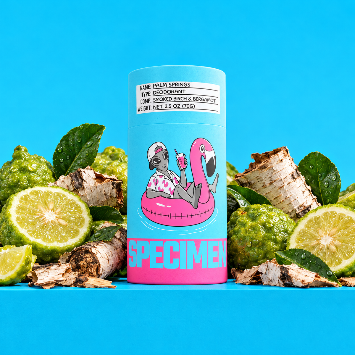 Specimen Palm Springs natural deodorant with bergamot, sliced citrus and smoked birch bark on a bright blue backdrop