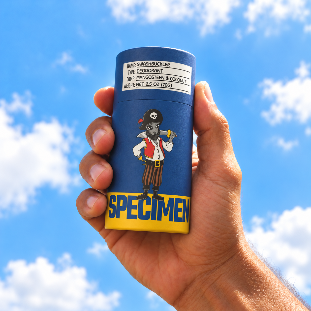 Hand holding Specimen Swashbuckler aluminum-free deodorant against a bright blue sky